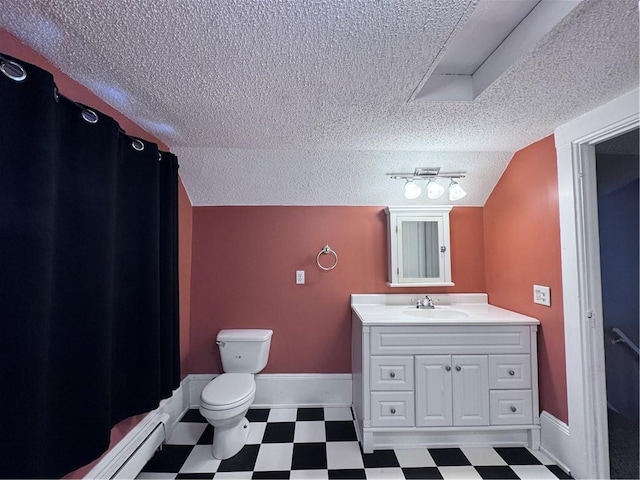 bathroom with vanity, toilet, vaulted ceiling, and a textured ceiling