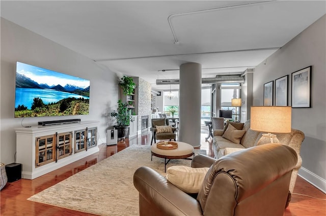 living room with wood-type flooring and a notable chandelier