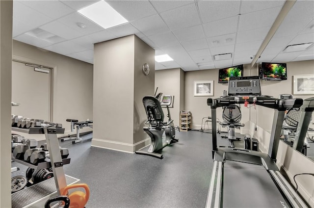 workout area featuring a drop ceiling