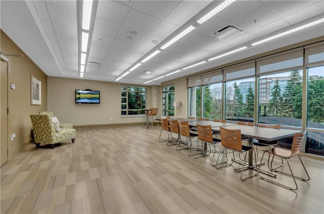 dining space featuring a drop ceiling