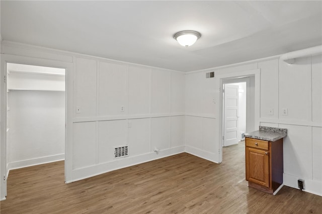 unfurnished room featuring wood-type flooring