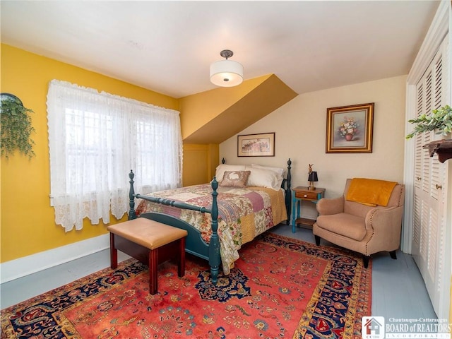 bedroom with lofted ceiling