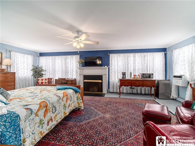 bedroom featuring crown molding, ceiling fan, and baseboard heating