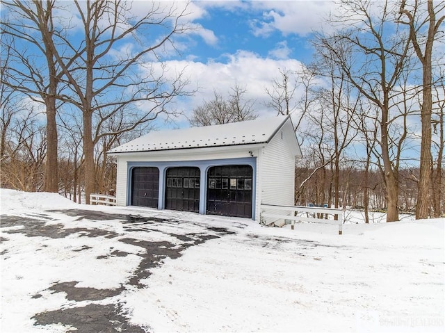 view of snow covered garage