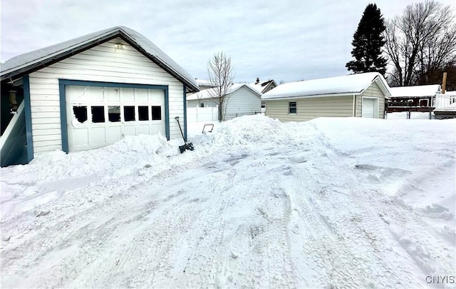 exterior space with a garage and an outdoor structure