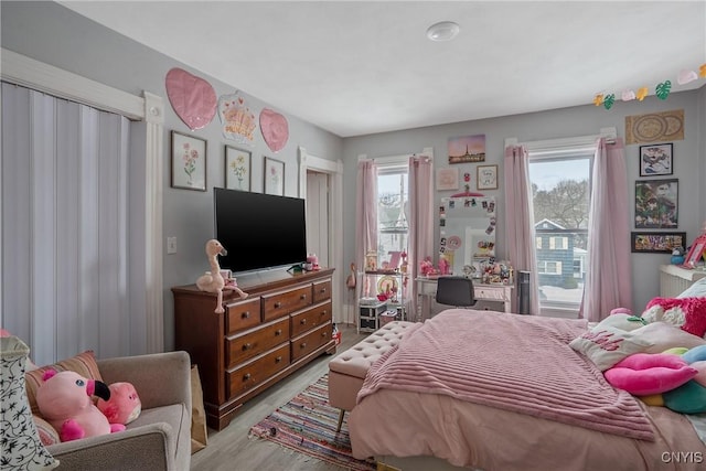 bedroom featuring light wood-type flooring