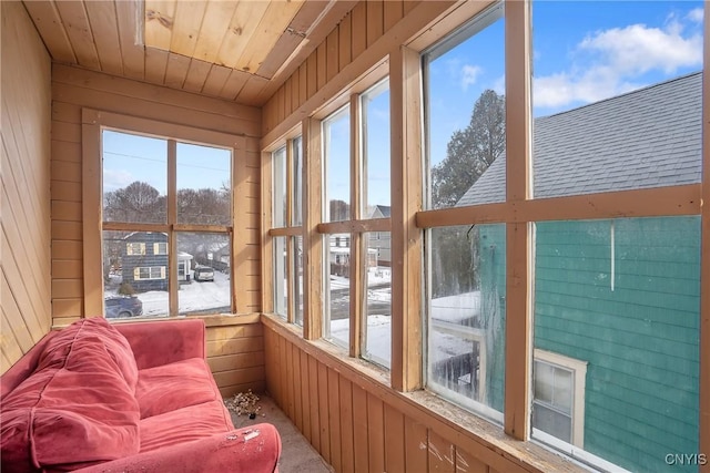 sunroom / solarium featuring wooden ceiling