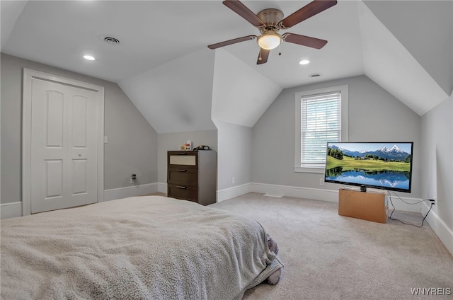 bedroom with lofted ceiling, light colored carpet, and ceiling fan