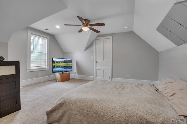 carpeted bedroom featuring lofted ceiling and ceiling fan