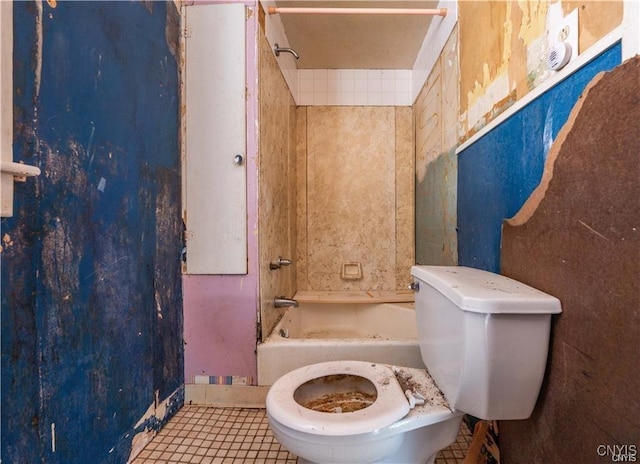 bathroom with shower / bathing tub combination, tile patterned floors, and toilet