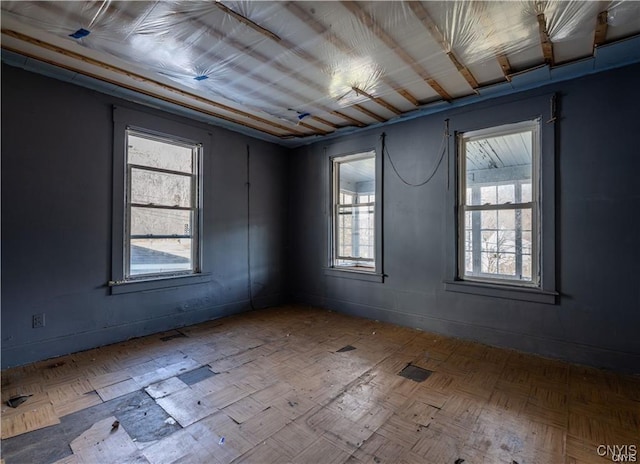 empty room with parquet flooring