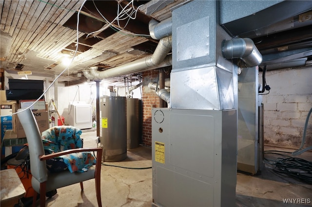 utility room featuring washer / clothes dryer and water heater