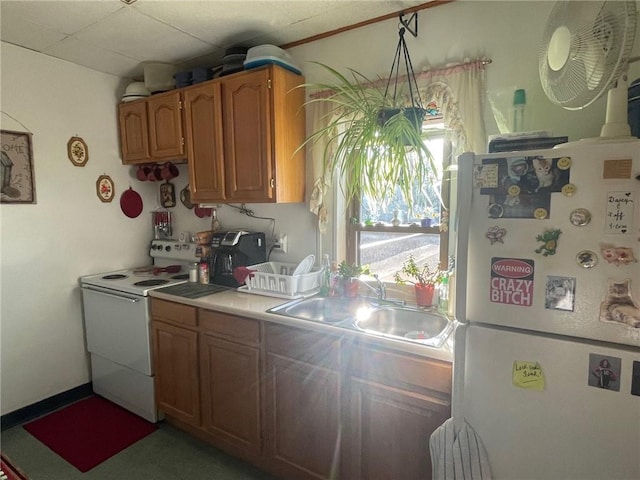 kitchen with sink, white appliances, and tile countertops