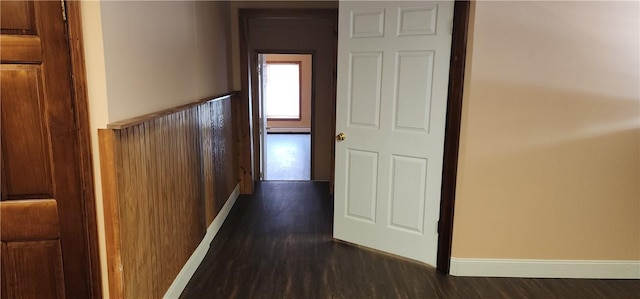 corridor with dark hardwood / wood-style floors