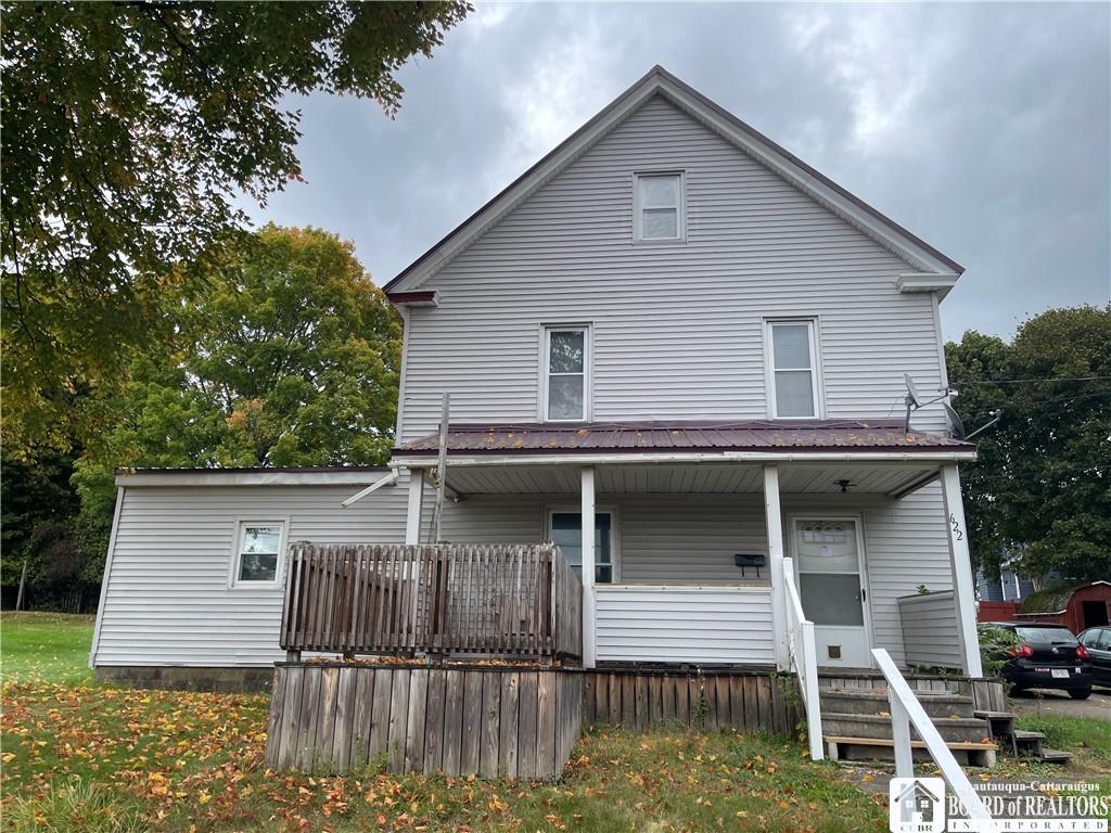 back of property with covered porch