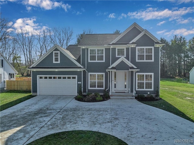 view of front of property with a garage and a front yard