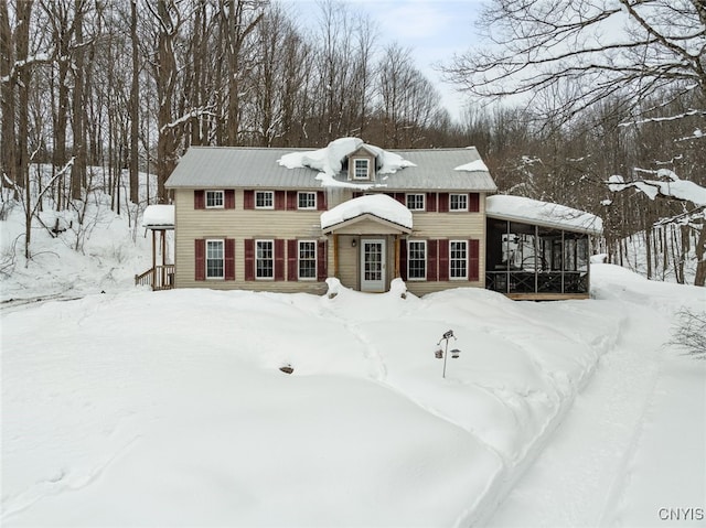 view of front of property featuring a sunroom