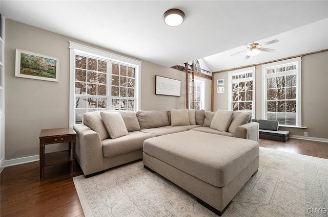 living room with hardwood / wood-style flooring, lofted ceiling, and a healthy amount of sunlight