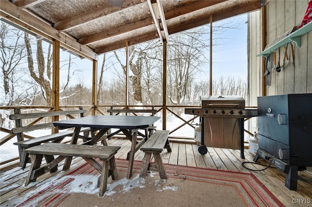 snow covered deck with grilling area