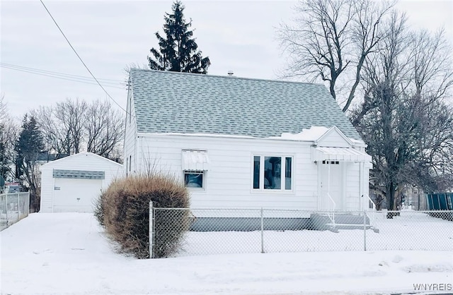 view of front facade featuring a garage and an outdoor structure