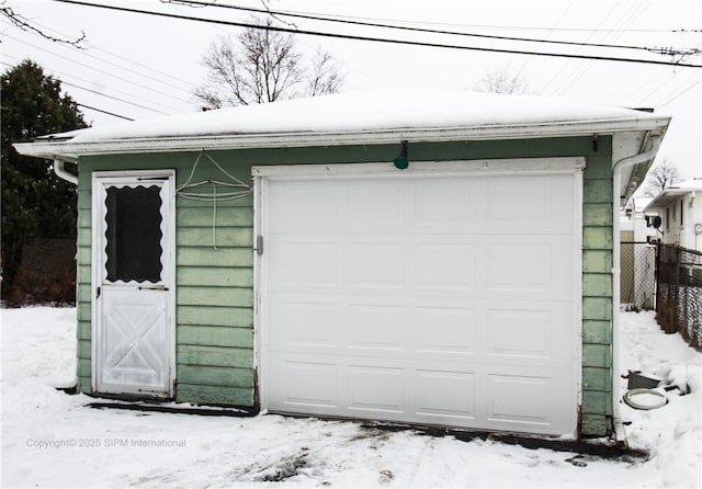 view of snow covered garage