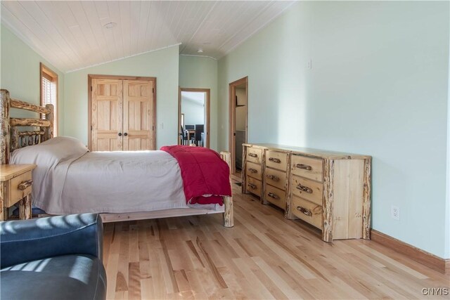 38908/912 Bartlett Point Rd Unit 912, Clayton, NY 13624 - bedroom featuring light wood-style floors, vaulted ceiling, wooden ceiling, a closet, and baseboards