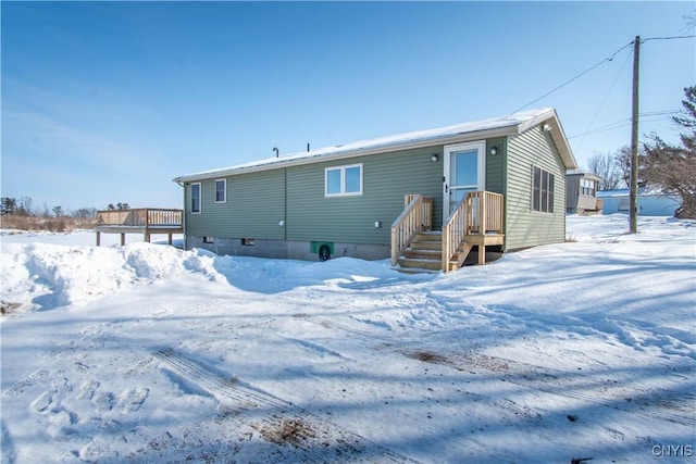 view of snow covered house