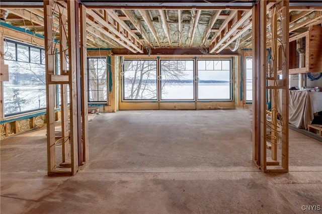 misc room featuring plenty of natural light and a water view