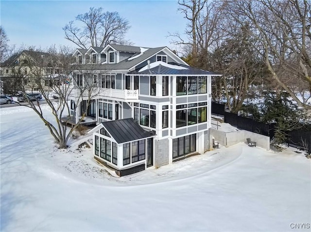 view of front of house with a sunroom