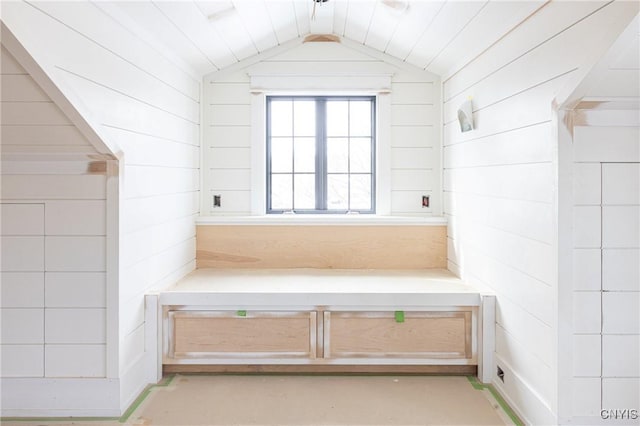 bathroom featuring lofted ceiling