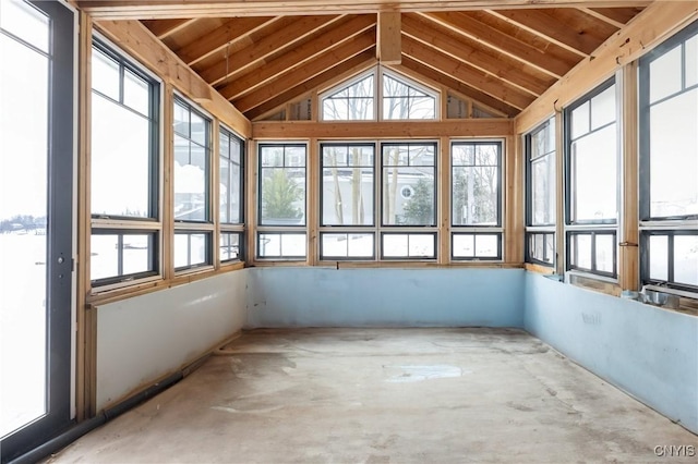 unfurnished sunroom featuring vaulted ceiling