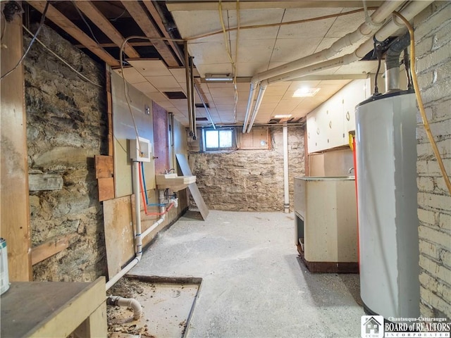 basement with sink and gas water heater