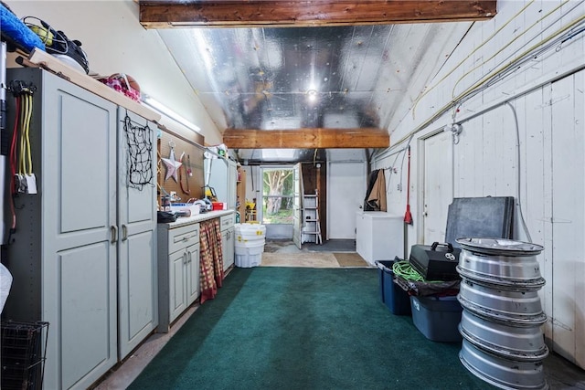 interior space featuring washer / clothes dryer and lofted ceiling with beams