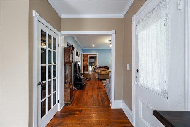 foyer entrance with hardwood / wood-style flooring and ornamental molding