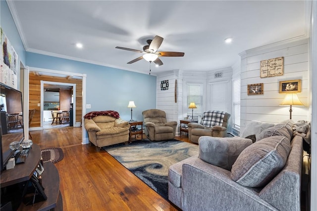 living room with crown molding, dark hardwood / wood-style floors, and ceiling fan