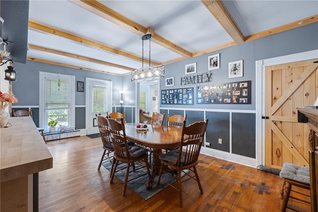 dining area featuring dark hardwood / wood-style flooring, beamed ceiling, and baseboard heating