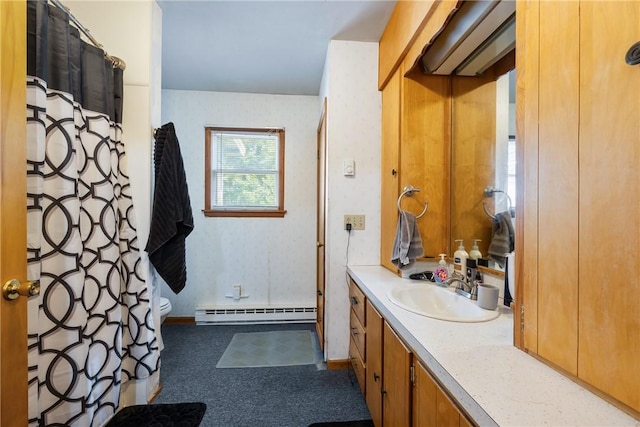 bathroom featuring vanity, toilet, curtained shower, and a baseboard heating unit