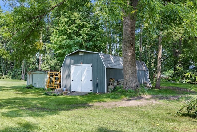 view of outbuilding featuring a lawn