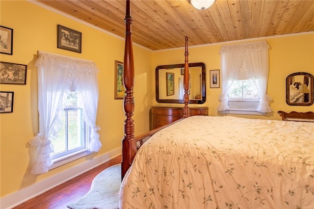 bedroom with wood ceiling, ornamental molding, and hardwood / wood-style flooring