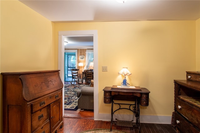 hall with dark hardwood / wood-style flooring