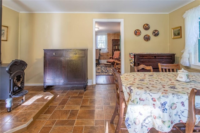 dining area featuring crown molding