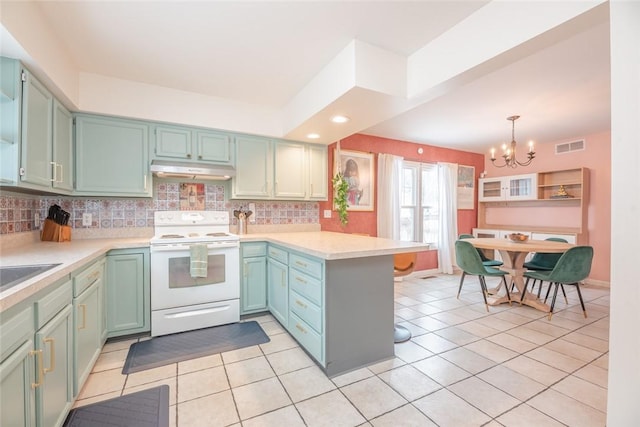 kitchen featuring light tile patterned floors, white electric range, decorative light fixtures, and kitchen peninsula