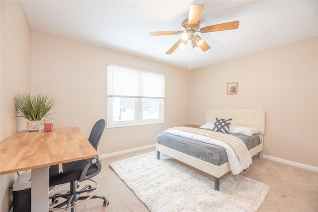 bedroom featuring light colored carpet and ceiling fan