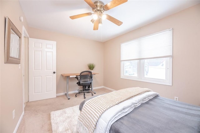 bedroom featuring light carpet and ceiling fan