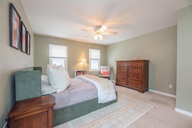 bedroom with light colored carpet and ceiling fan