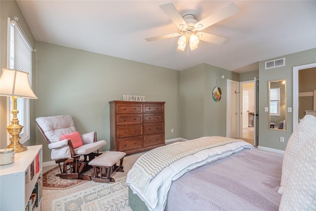 bedroom with ceiling fan and light colored carpet