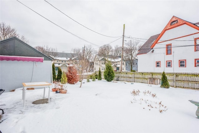 view of yard layered in snow