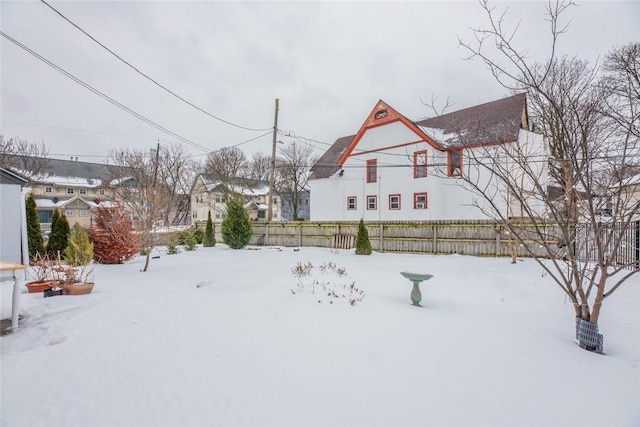 view of yard layered in snow