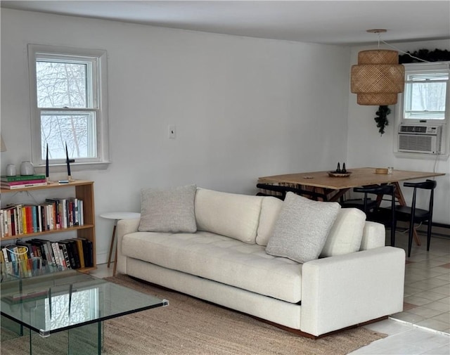 living room featuring cooling unit and light tile patterned floors