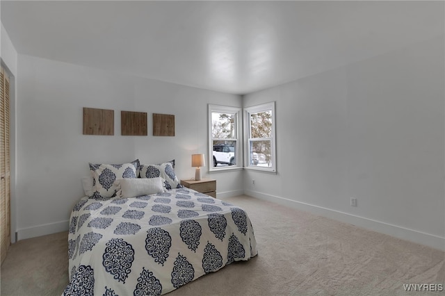 bedroom featuring light colored carpet